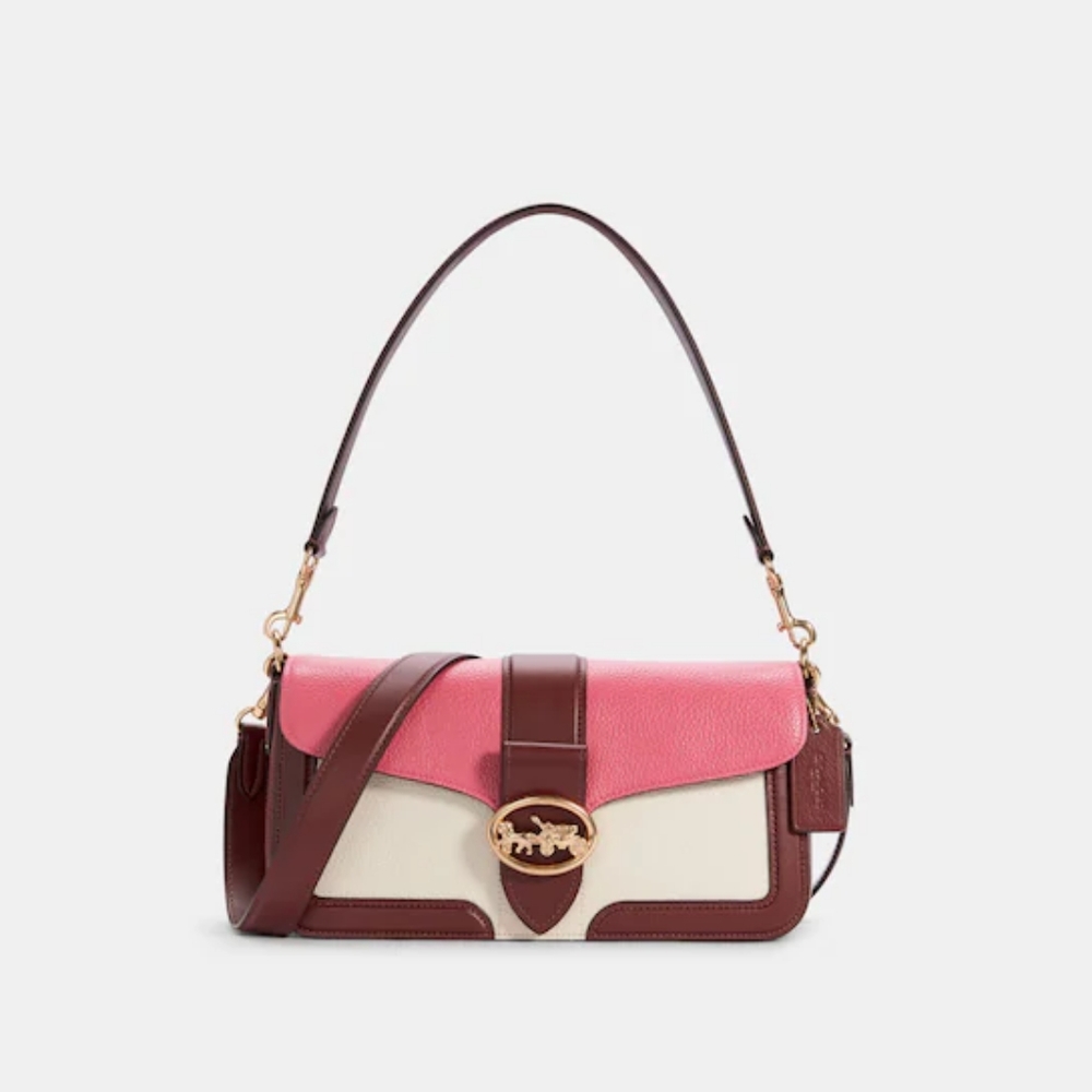 A Georgia color block shoulder bag Coach retails for $348 brand new never used